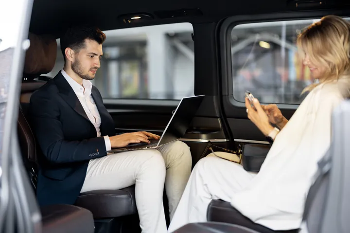 Passengers traveling in a van for business